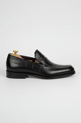 Black leather textured formal loafers with elegant design for business and weddings.